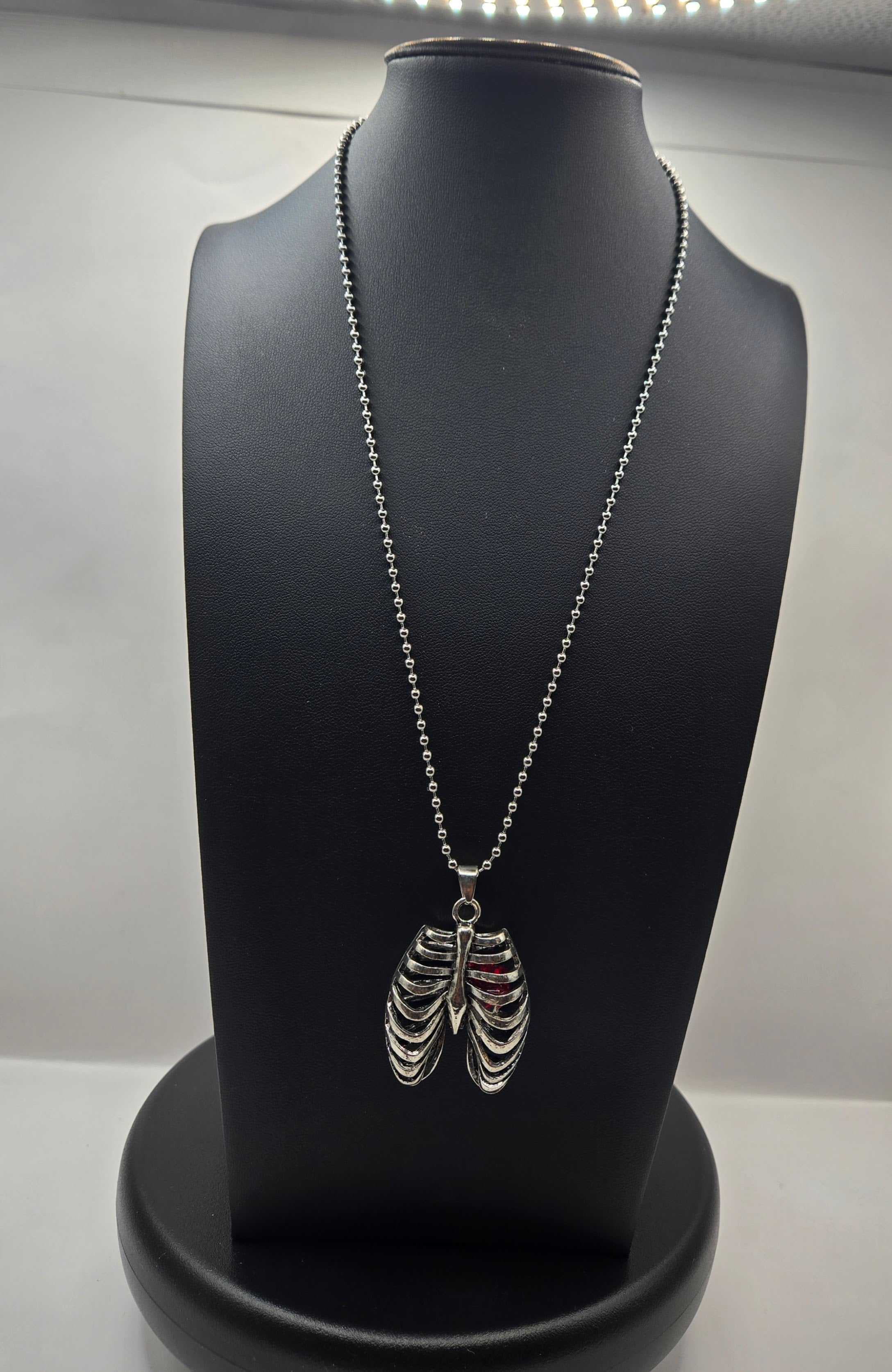 MR. BONES' RIB CAGE/CRYSTAL HEART PENDANT