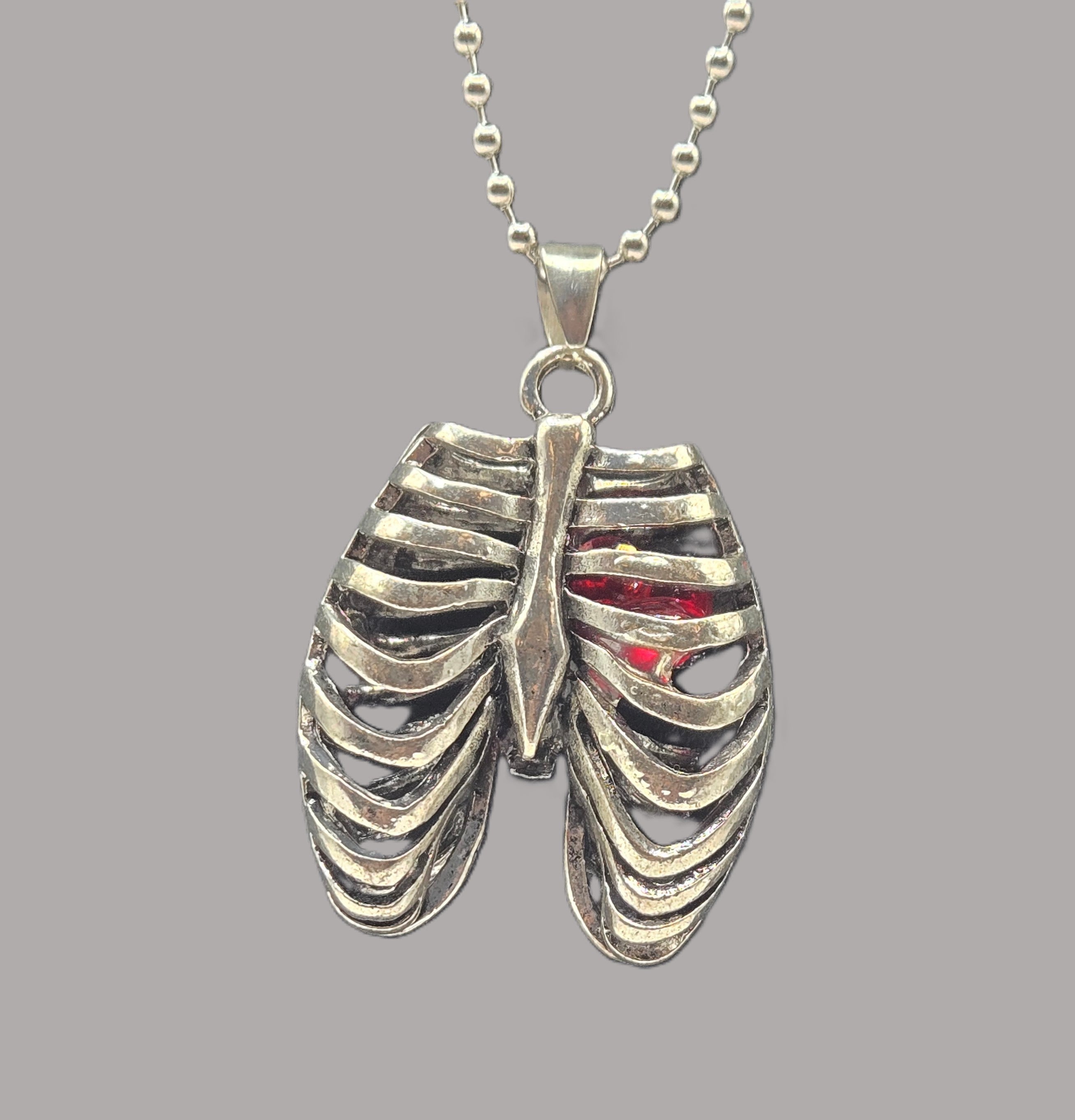 MR. BONES' RIB CAGE/CRYSTAL HEART PENDANT