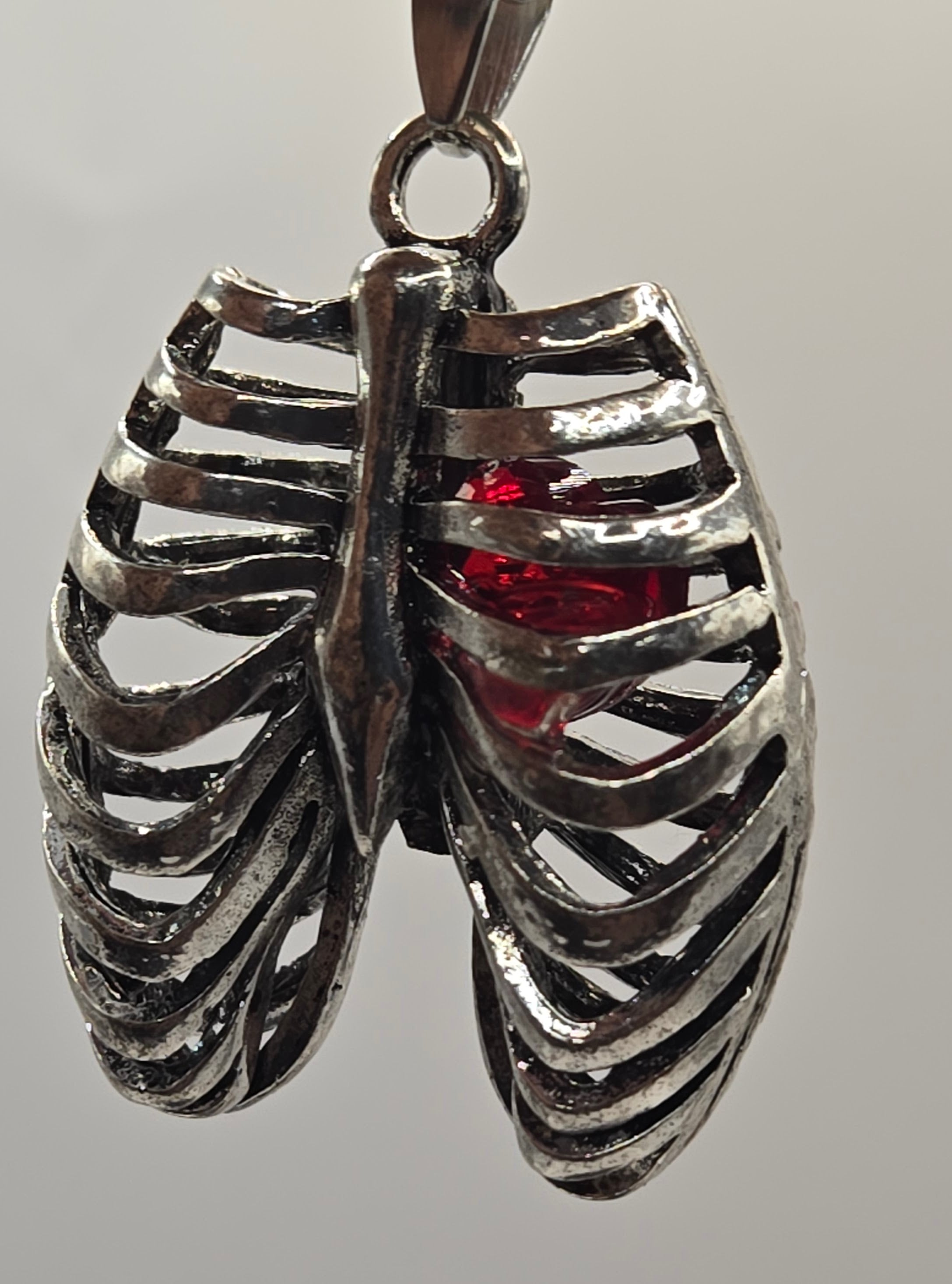 MR. BONES' RIB CAGE/CRYSTAL HEART PENDANT