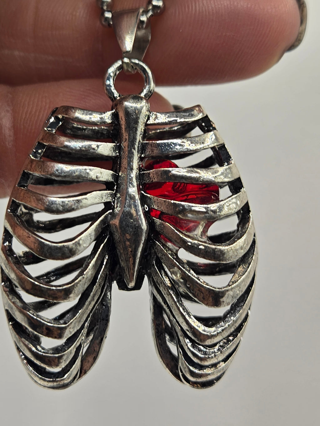 MR. BONES' RIB CAGE/CRYSTAL HEART PENDANT